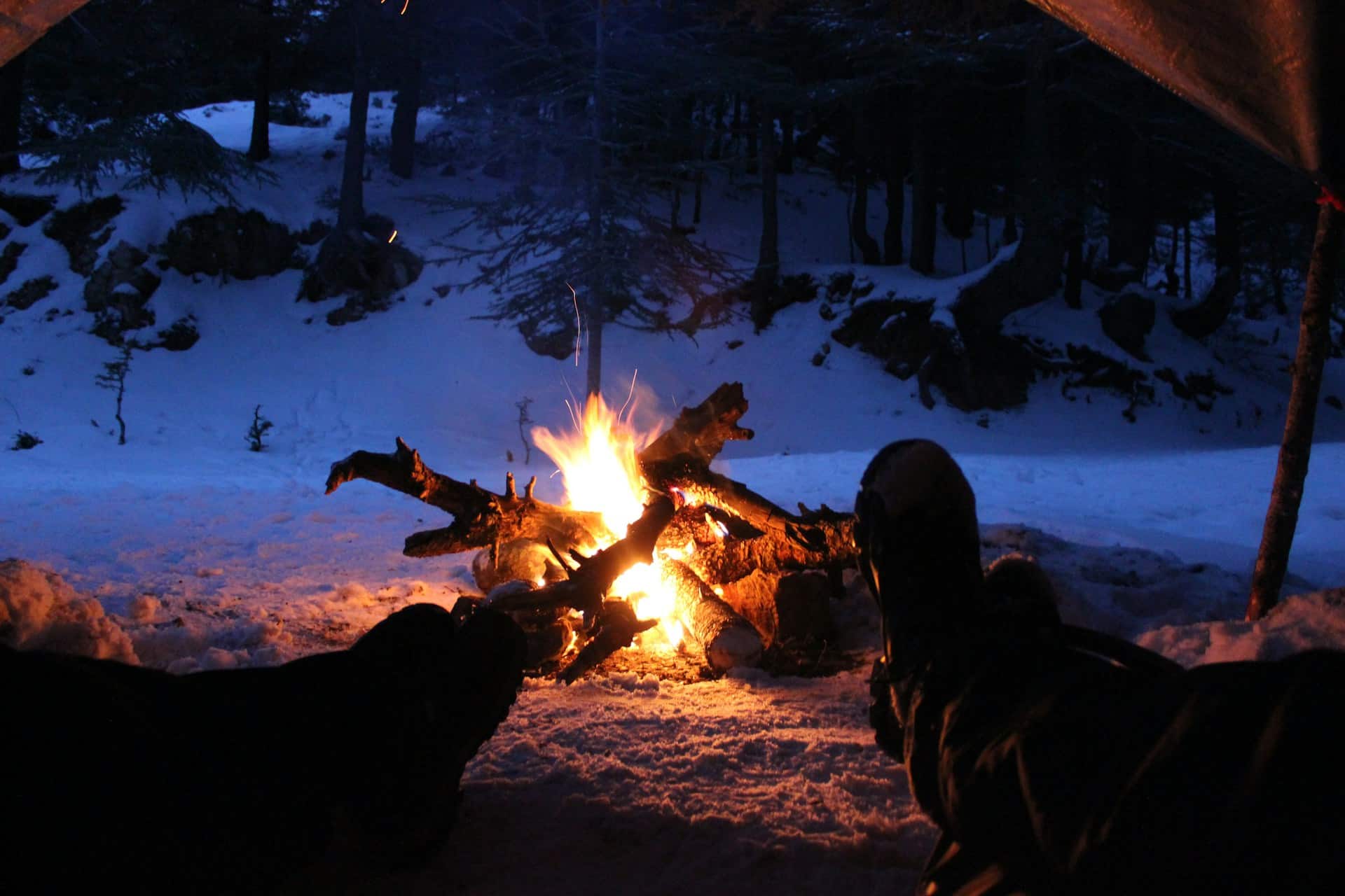 Sitting Around The Campfire On A Winter Camping Trip